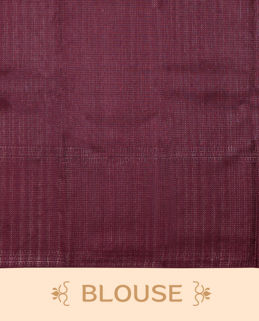 Dark Maroon coloured Manthrakodi saree featuring a multicoloured zari jacquard body, complemented by a self coloured turning Banarasi border and a matching self coloured blouse.