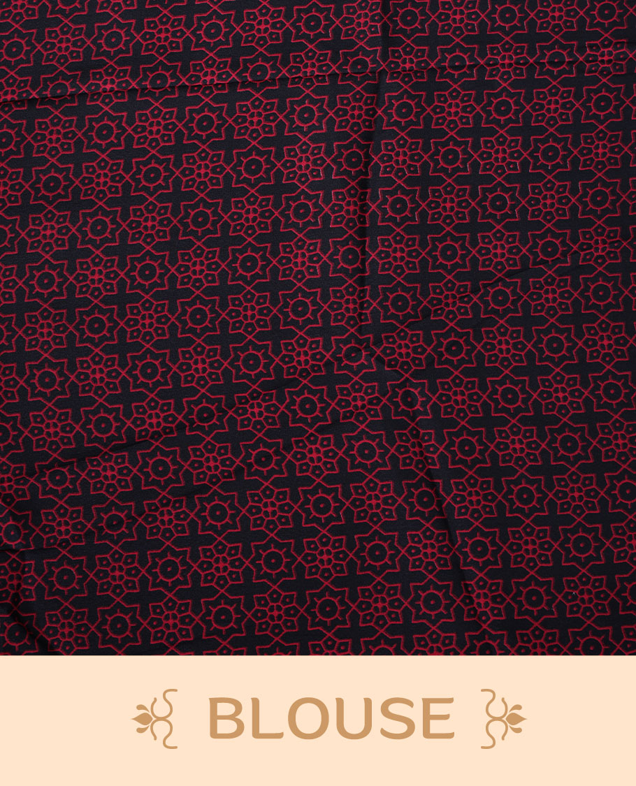 Black colour semi modal saree highlighted with red triangle border accents and sleek striped detailing across the drape, featuring a bold oversized red circular motif on the pallu, paired with a matching printed blouse.