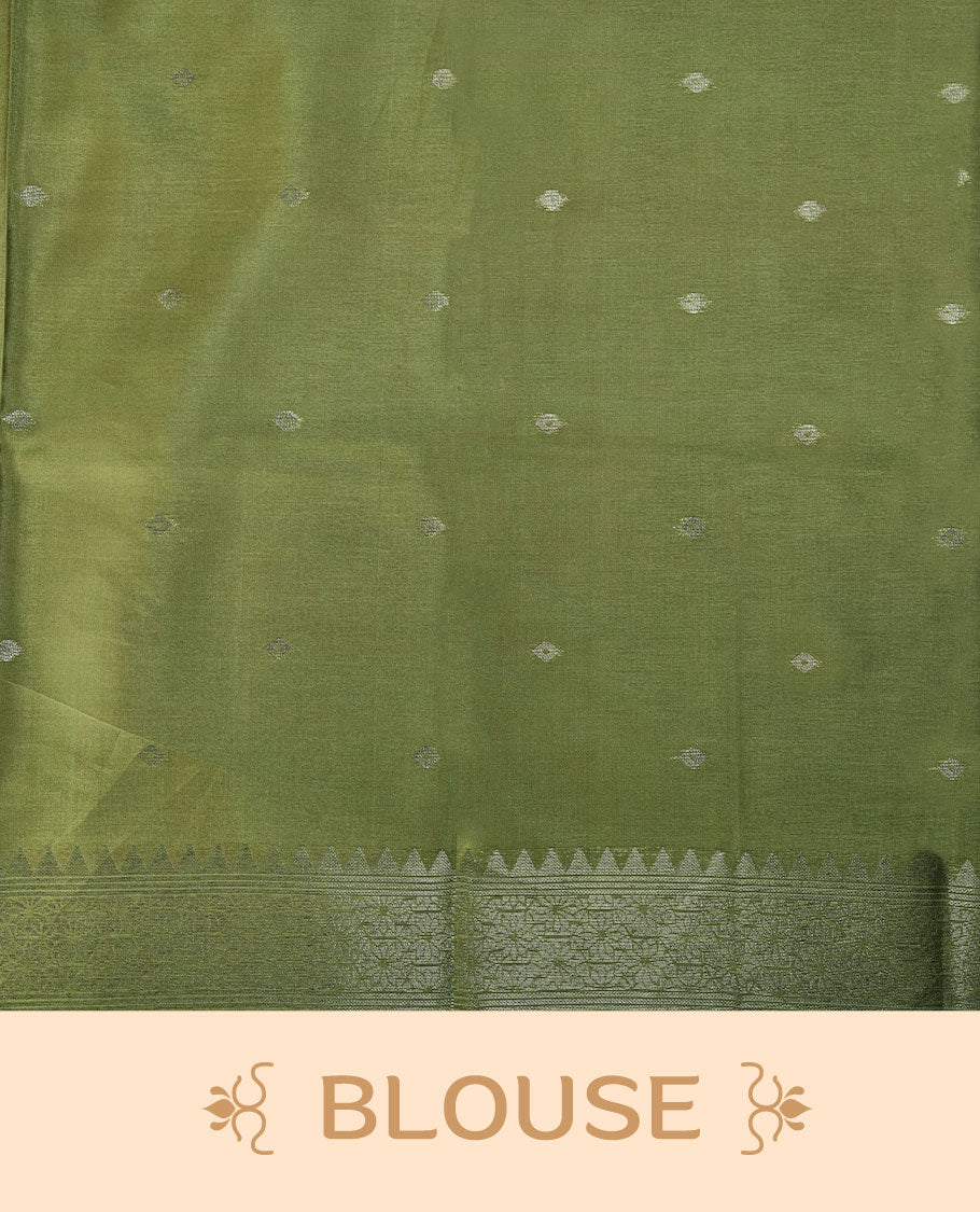 Green color semi tussar Banarasi saree featuring vibrant multi-color floral prints across the body, with shimmering geometric zari patterns, and a matching blouse detailed with silver woven buttas.
