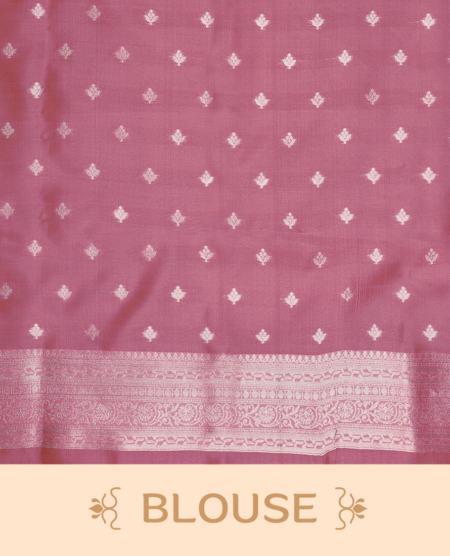 Silver coloured semi silk saree featuring a self coloured floral jaal design on the body, paired with an onion coloured border and matching blouse.