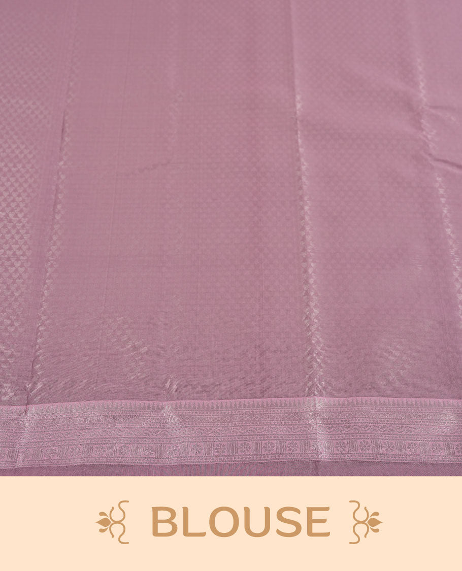 Black colour semi silk saree adorned with subtle silver zari motifs on the body, complemented by a pastel pink pallu intricately woven with rich floral patterns border and pallu, and paired with a matching blouse