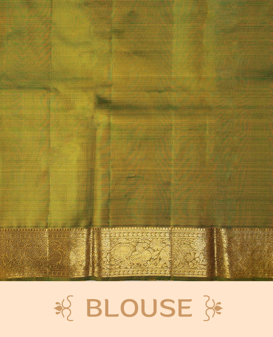 Mustard colour pure Kancheepuram saree with gold zari Mayoora chackra motifs on the body traditional contrast border with elephant and annam motifs grand pallu paired with matching blouse