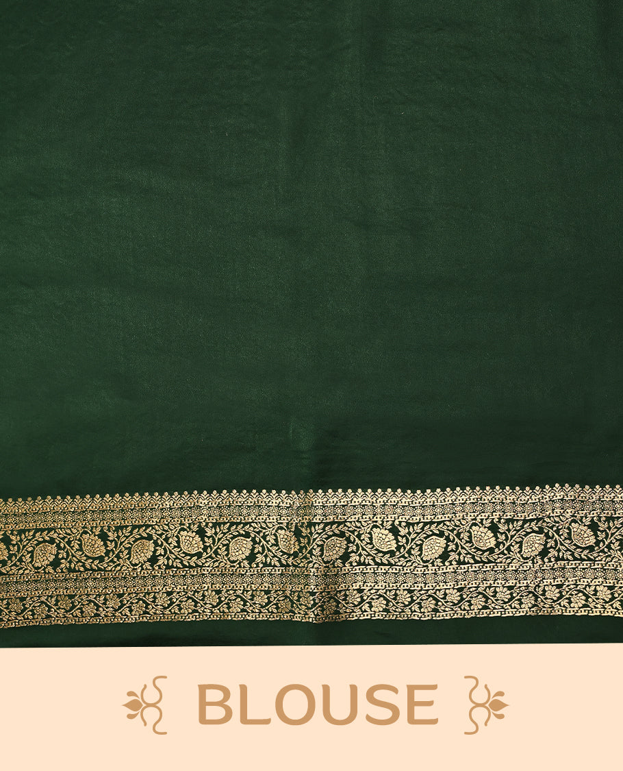 Bottle green semi-Banaras satin crepe saree featuring traditional closely woven buttas on the body, complemented by an antique-style border and a matching self-coloured blouse.