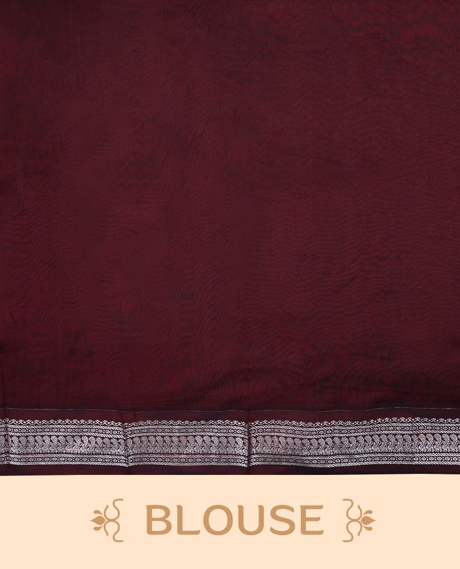 Bottle Green colour mixed Kalyani cotton saree featuring Silver zari flower motifs throughout the body, paired with a Maroon colour traditional border and pallu, with matching blouse