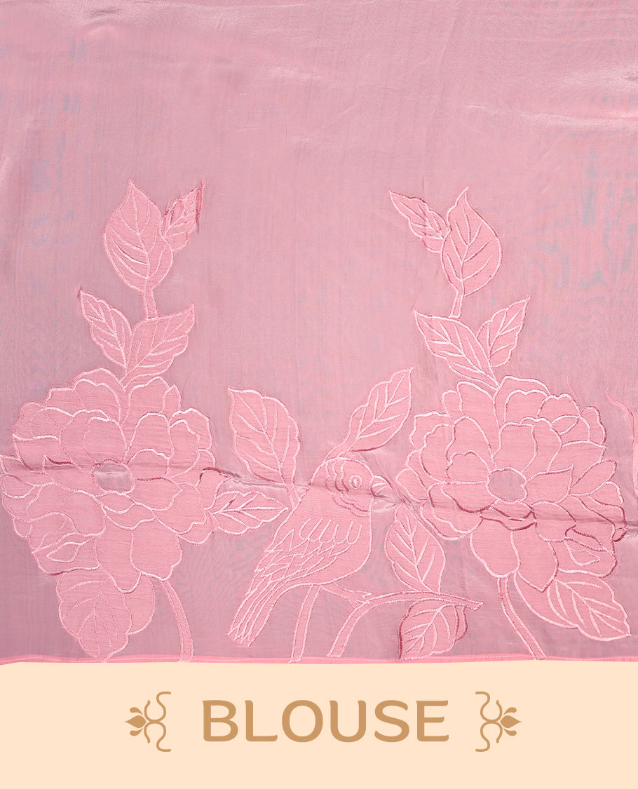Light baby pink colour pure organza silk saree featuring applique floral work on the body, a delicate thin border, and paired with a matching blouse
