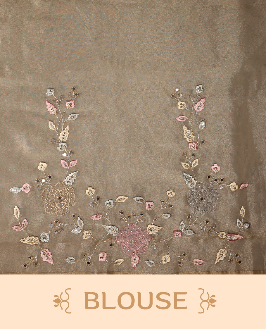 Dusty Pastel Brown colour organza saree featuring delicate floral embroidery with applique bead, mirror, and thread detailing on the body and scalloped border, lending a soft feminine charm, paired with a matching blouse.