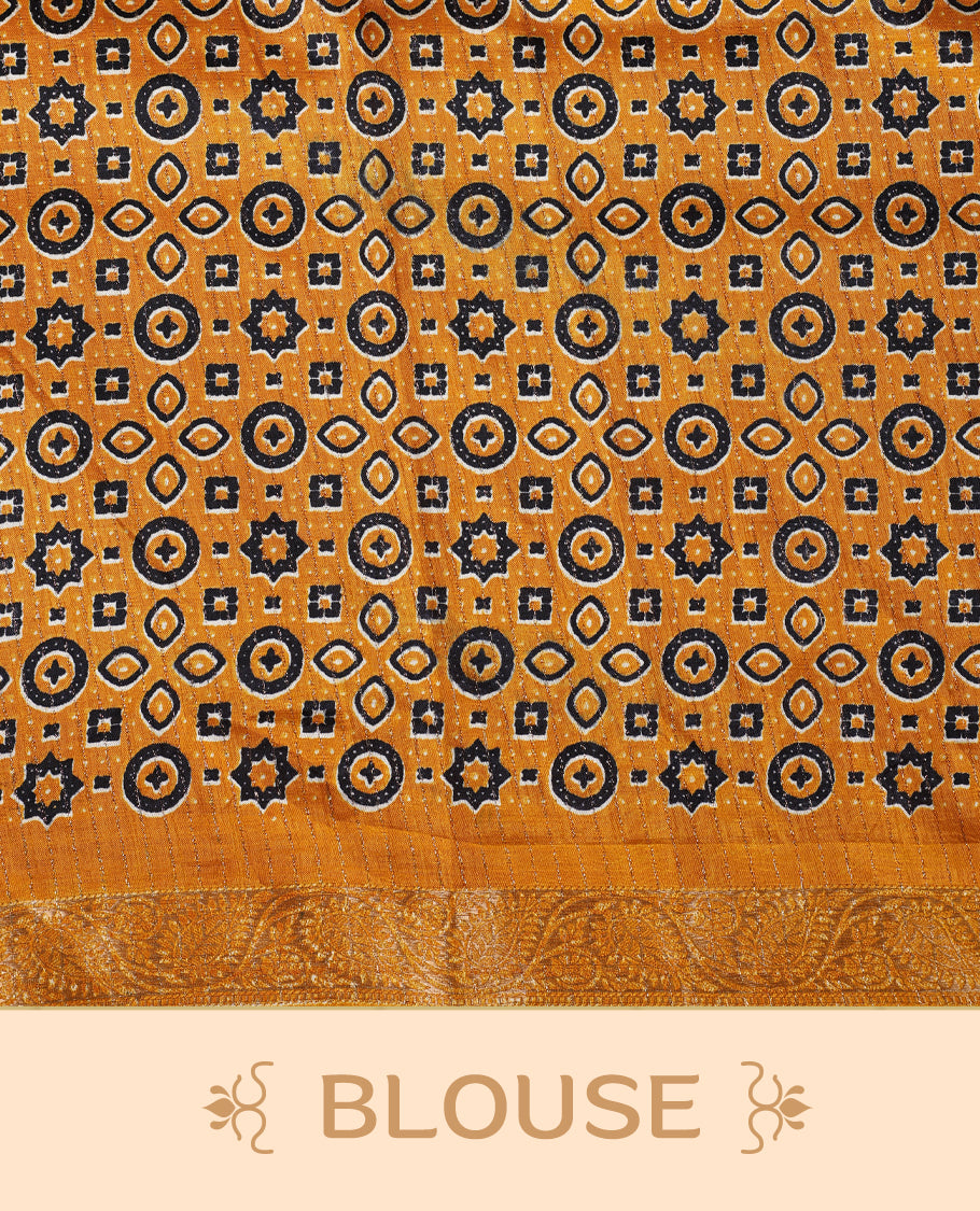 Beige Dolla silk saree featuring antique zari stripes across the body, adorned with a striking Ajrak and Traditional yellow colour border, ajrak printed pallu and paired with a perfectly matching blouse.