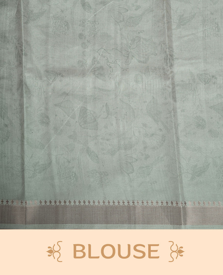 Mint green colour semi tussar silk saree featuring all over floral and leaf motifs on the body with a subtle self border and tasselled pallu, paired with a matching blouse.