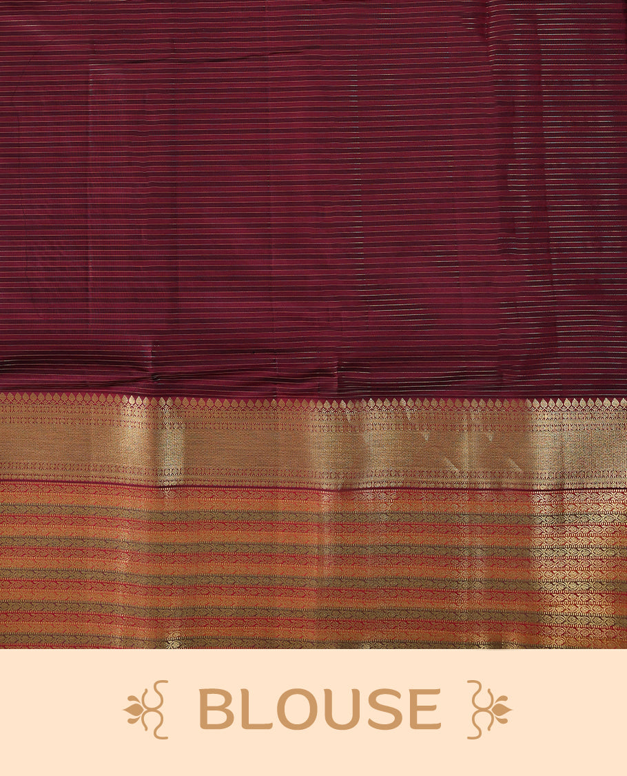 Warm brown Colour soft silk saree with subtle reddish undertones, adorned with golden vertical pinstripes, featuring a contrasting traditional border and paired with a matching blouse.