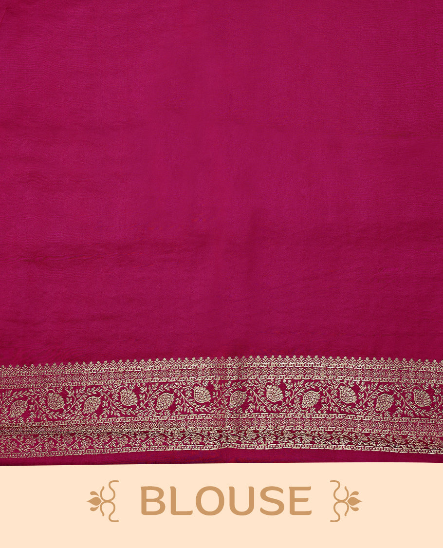 Rani Pink semi-Banaras satin crepe saree featuring traditional closely woven buttas on the body, complemented by an antique-style border and a matching self-coloured blouse.
