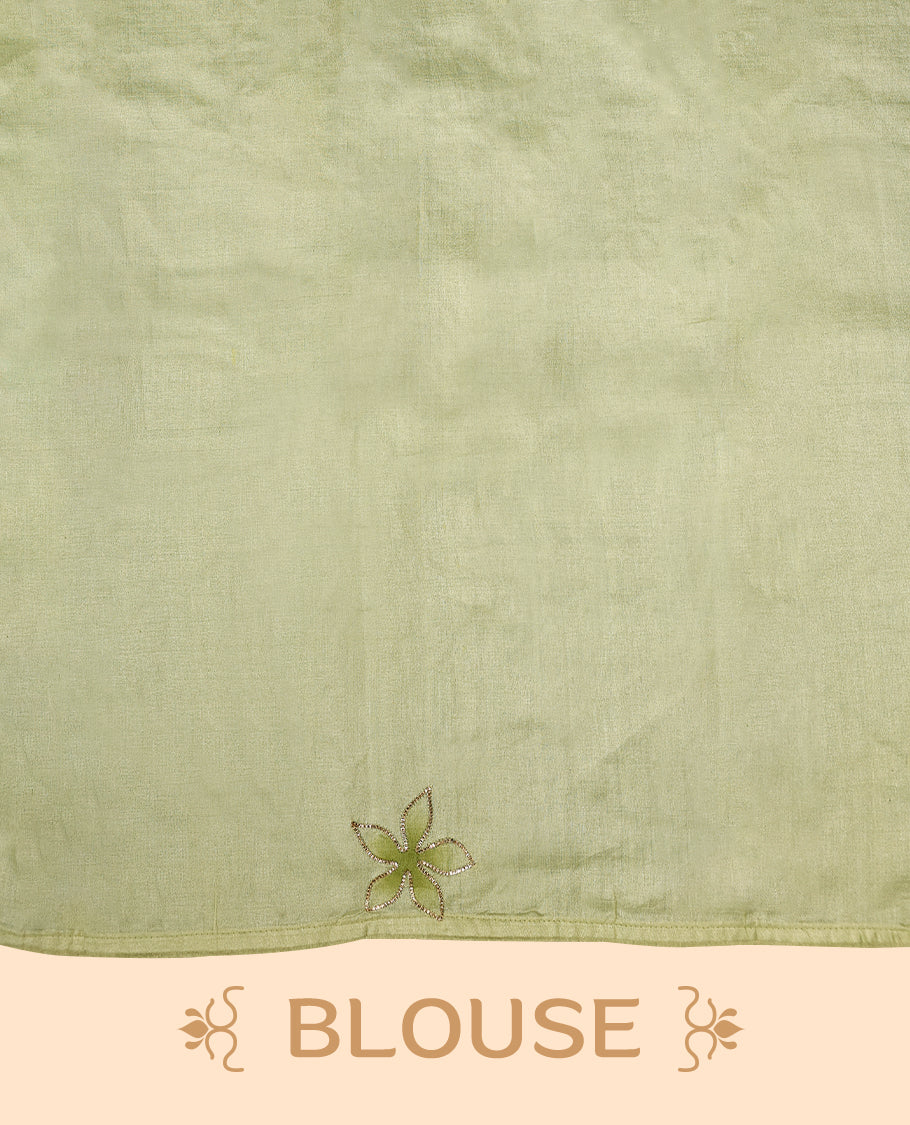 Light pastel green colour pure tussar silk saree featuring elegant hand painted floral designs, beautifully highlighted with subtle gotta work, paired with a matching blouse.