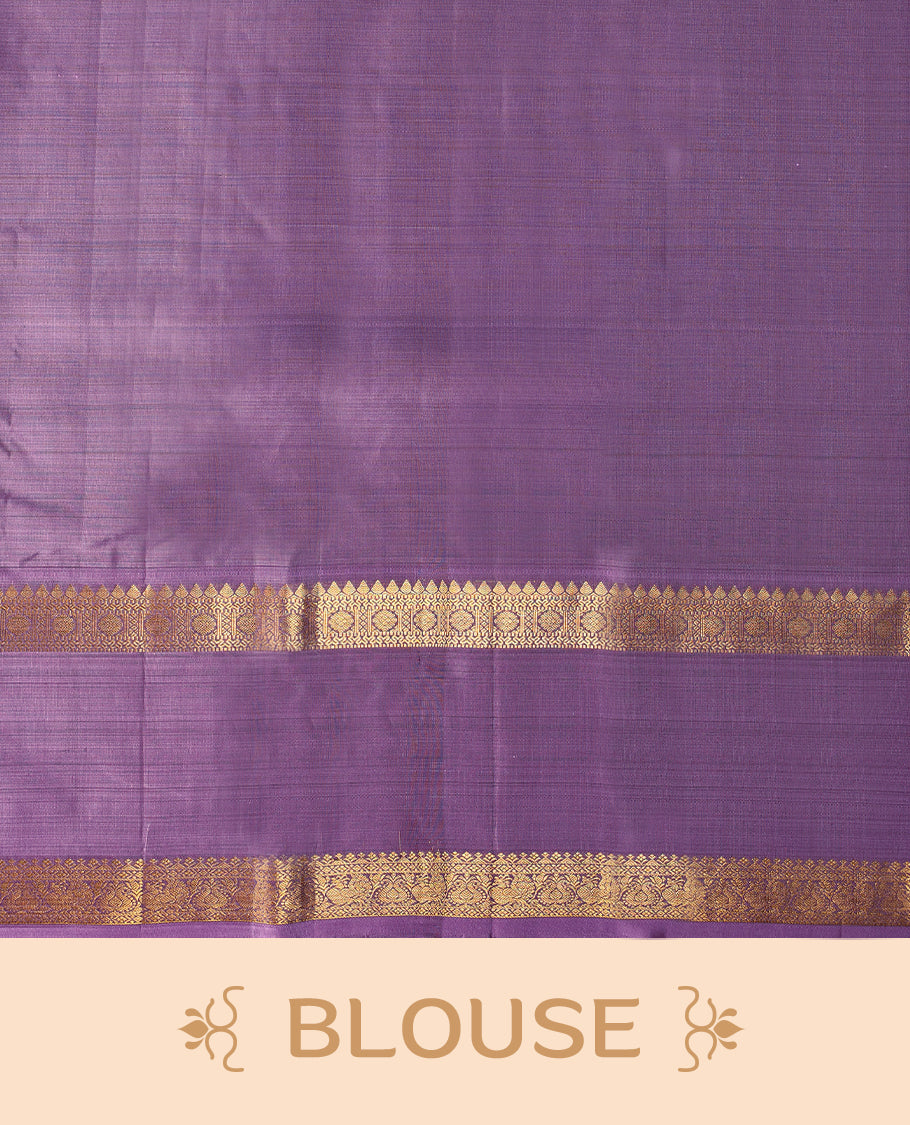 Dark chocolate Colour pure traditional Kancheepuram silk saree adorned with antique zari Chakkram motifs on the body, beautifully complemented by a contrasting traditional border, and paired with a matching blouse.