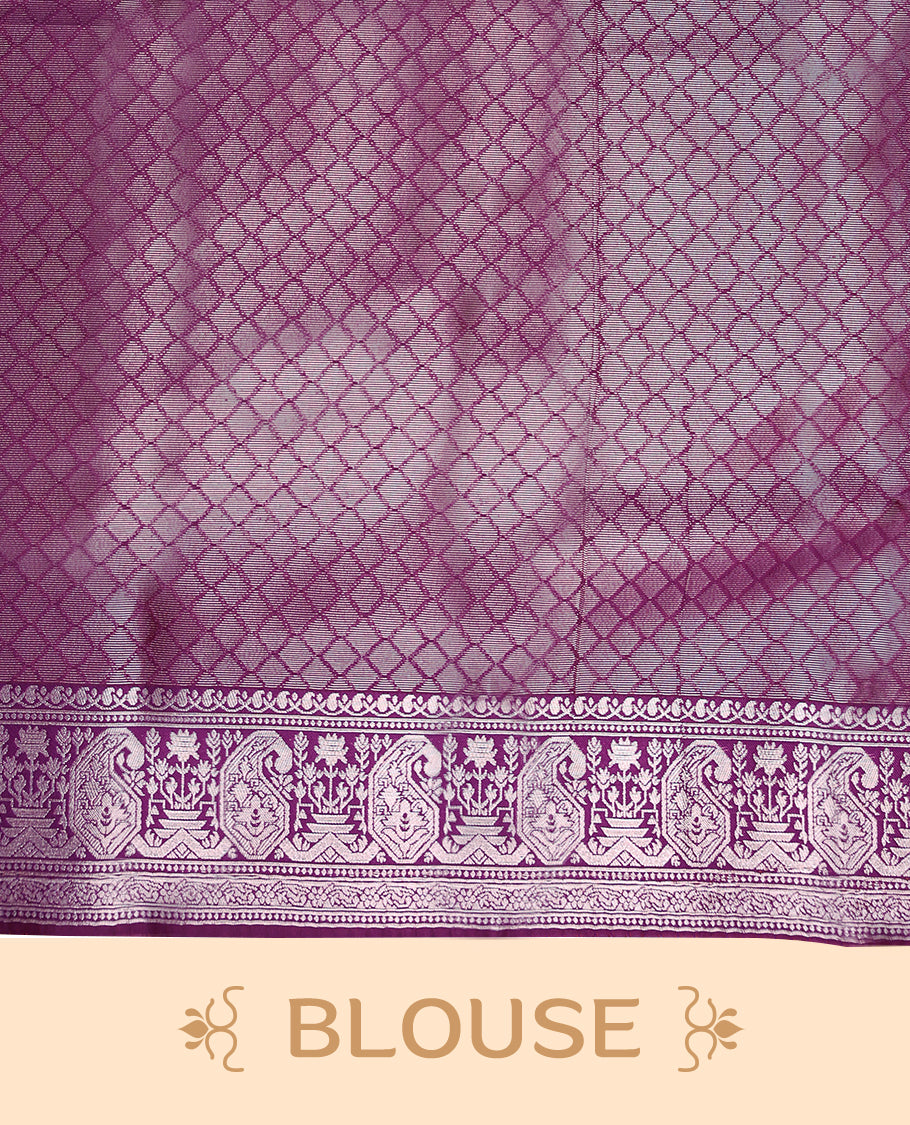 Mung Bean coloured semi silk saree featuring a Silver coloured Zari design on the body, paired with a Grape coloured border and matching blouse.