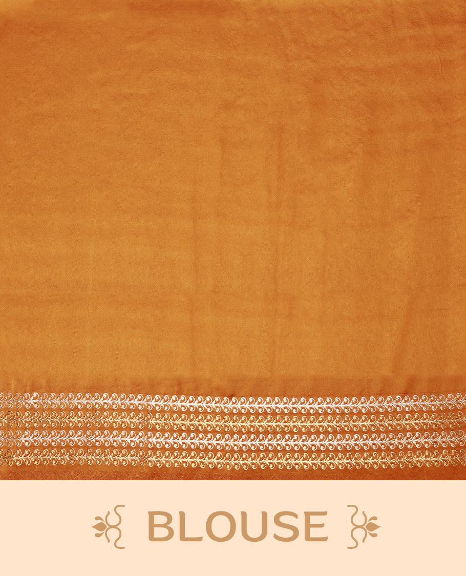 Burnt orange colour pure Banaras crepe saree showcases elegant silver zari Flower Motifs all over the body, a traditional Banarasi gold zari border, a rich intricately woven pallu, and comes with a matching blouse.