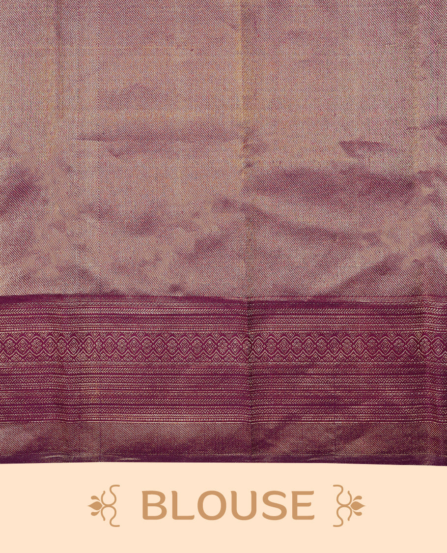 Grape wine Colour Manthrakodi saree featuring an antique zari brocade body, complemented by a self coloured traditional border and a matching self coloured brocade blouse.