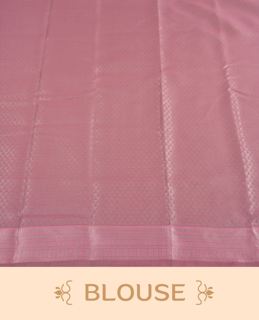 Aqua green colour semi silk saree adorned with subtle silver zari motifs on the body, complemented by a pastel pink pallu intricately woven with rich floral patterns border and pallu, and paired with a matching blouse