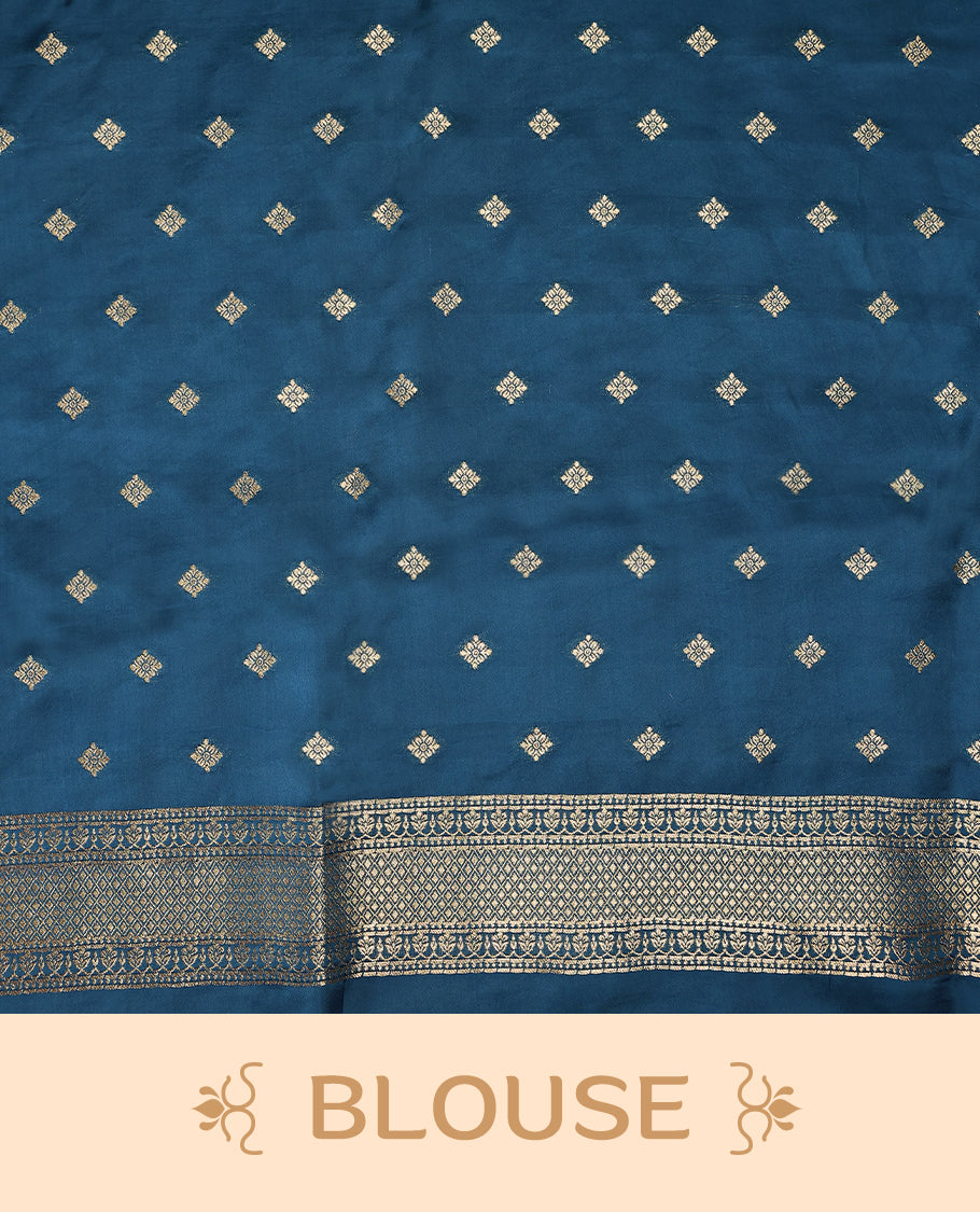 Peacock Blue colour pure Banaras crepe saree showcases elegant Gold zari Flower Motifs all over the body, a traditional gold & Silver zari border, a rich intricately woven pallu, and comes with a matching blouse.