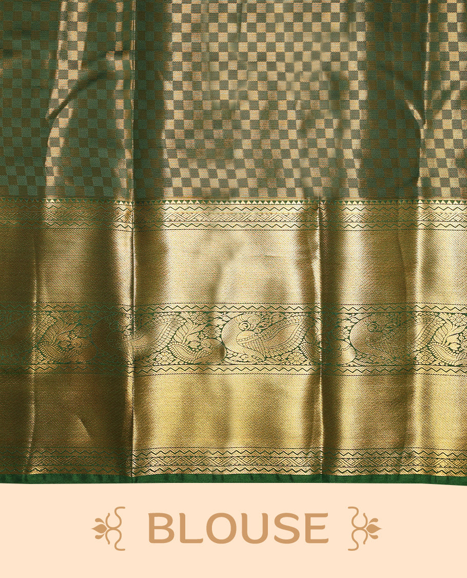 Gold colour tissue brocade saree with gold and silver zari lotus pattern on body, gold zari peacock and flower traditional green border, rich matching pallu with Antique zari motifs, paired with matching blouse.