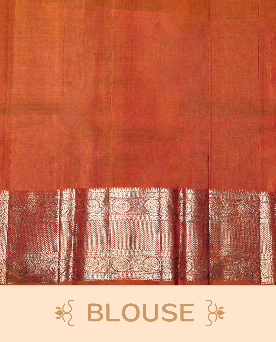 Wine colour pure Kancheepuram saree with gold zari small Mayoora chackara motifs on the body traditional contrast border with floral kodi motifs grand gold zari woven pallu paired with contrast matching blouse