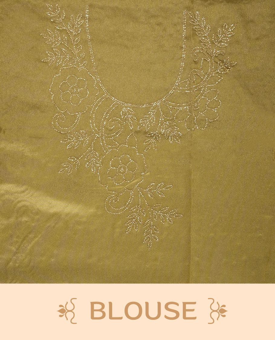 Golden olive colour net shimmer fancy saree adorned with white stone buttas, paired with a delicate stone worked border and matching blouse.