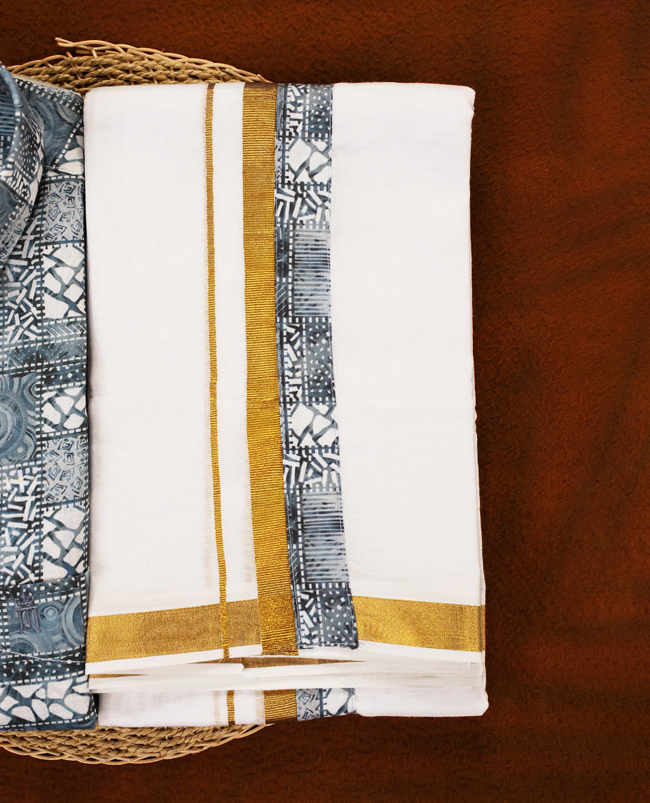 Pastel Blue colour MCR full sleeve shirt featuring all over abstract prints, paired with a white dhoti adorned with a rich golden zari kara and a matching printed border.
