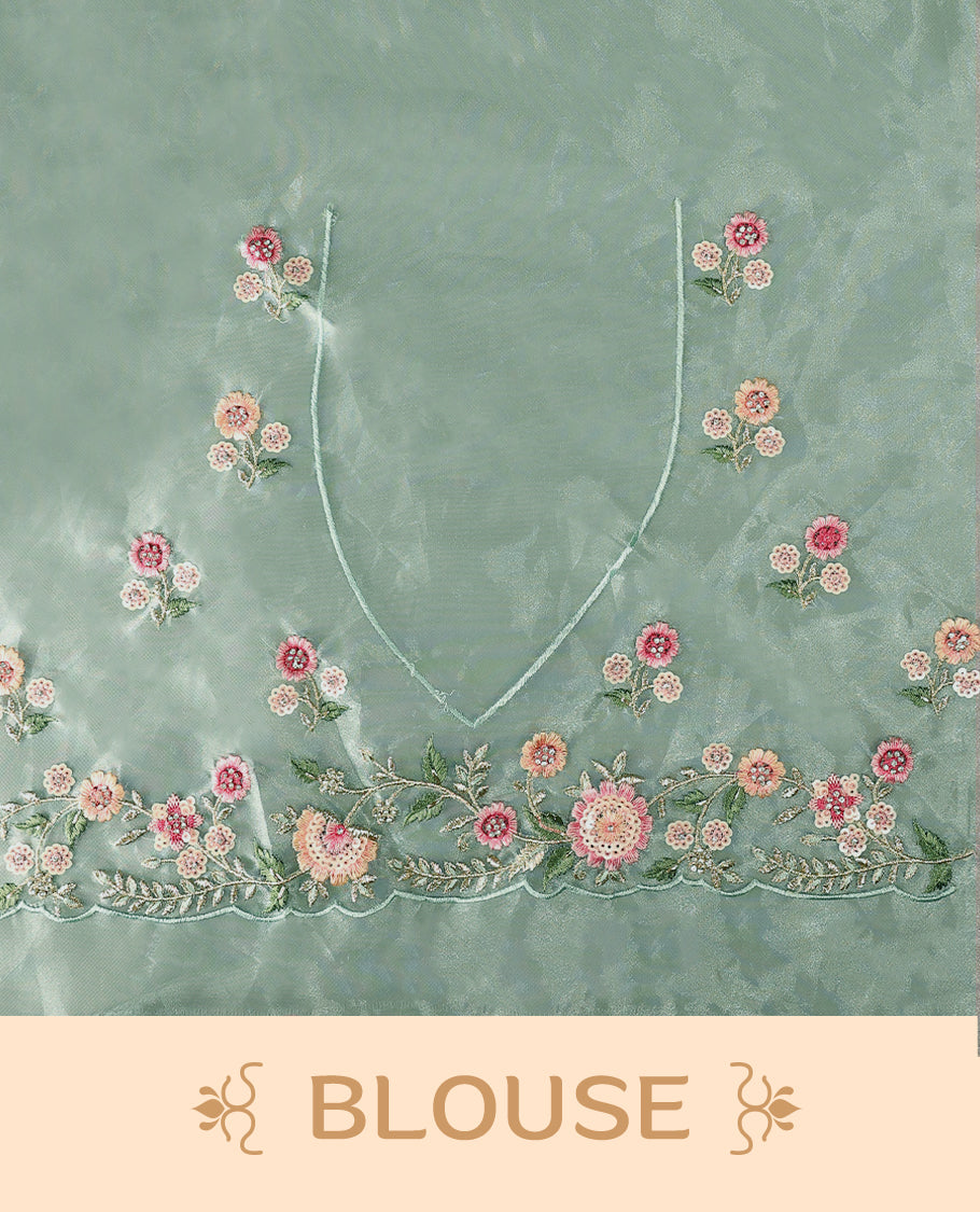 Pastel Aqua Organza Tissue Silk Saree is beautifully adorned with intricate pink floral embroidery Border and a matching blouse.