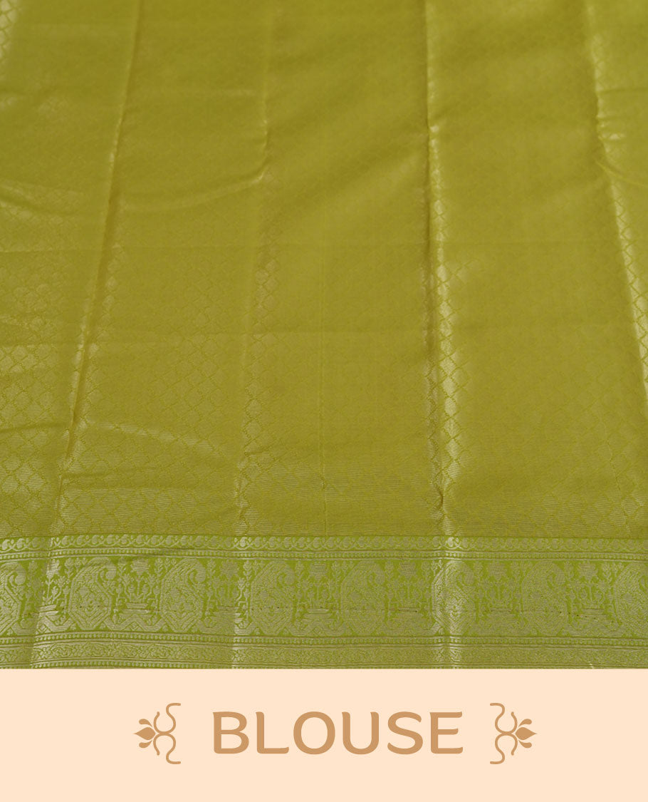 Light cream colour semi silk saree adorned with silver zari designs on the body, complemented by a contrasting olive green border and pallu, and paired with a matching blouse piece.