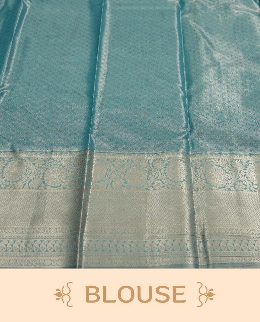 Aqua blue colour and Antique gold Zari Tissue Brocade Saree features intricate line Motifs on body and traditional border & pallu with floral patterns, paired with matching blouse