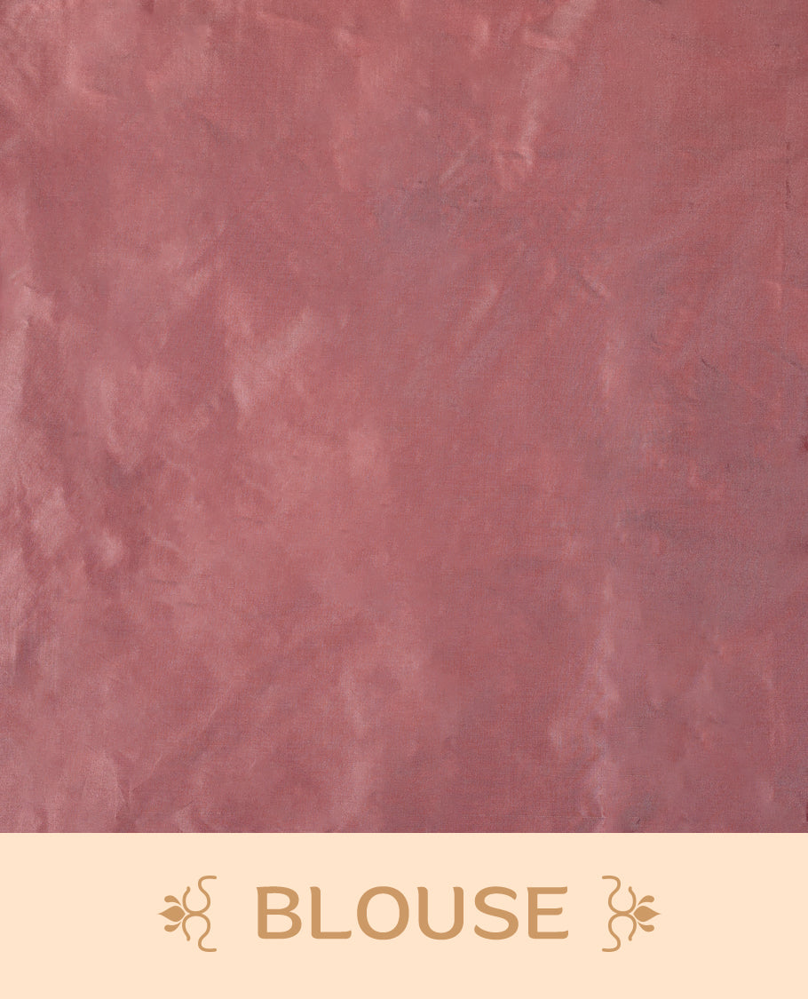 Peach pink colour semi silk saree featuring subtle textured checks on the body, complemented by a self-tone border, and comes with a matching blouse.