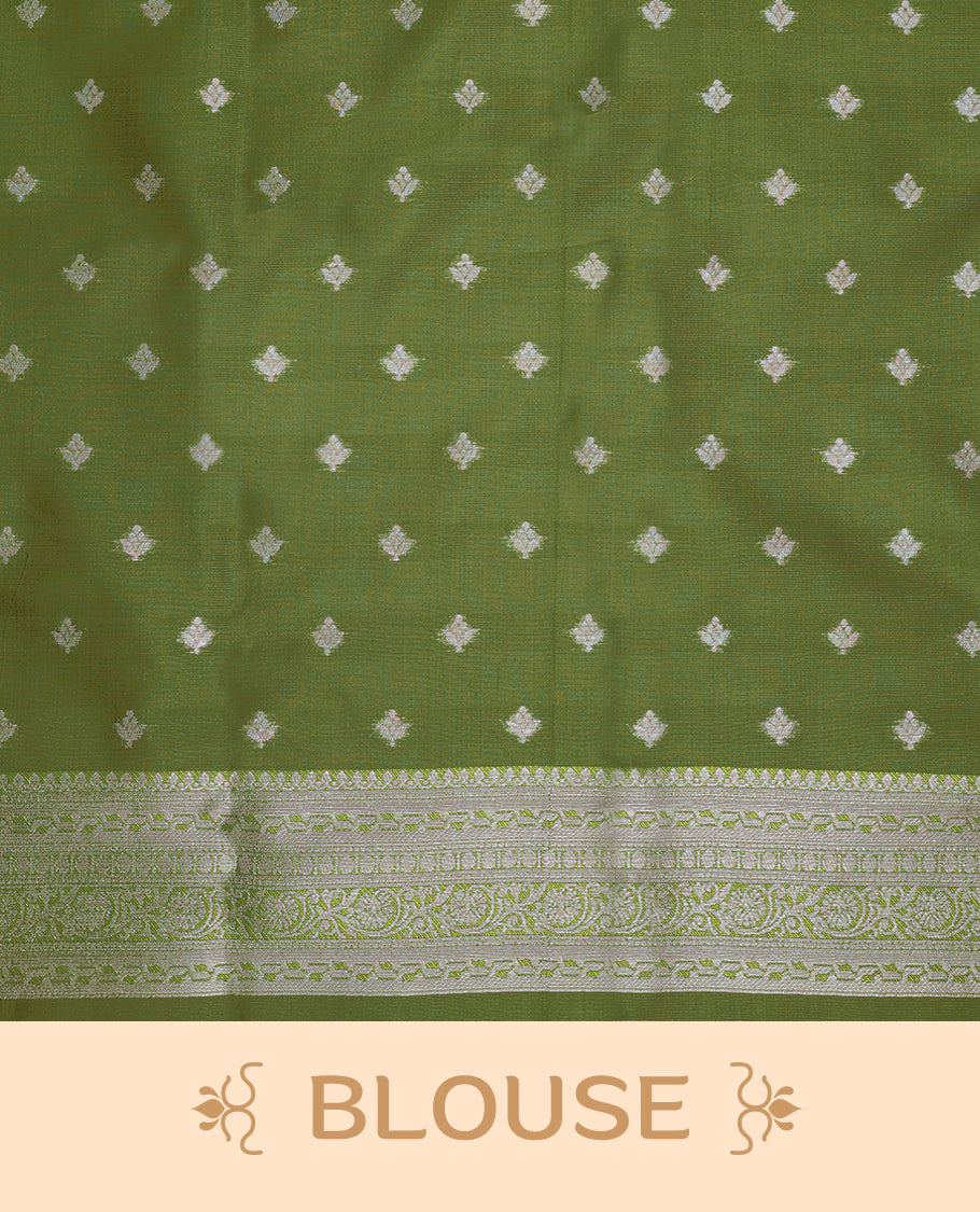 Light Pista coloured semi silk saree featuring a Silver coloured floral jaal design on the body, paired with a Green coloured border and matching blouse.