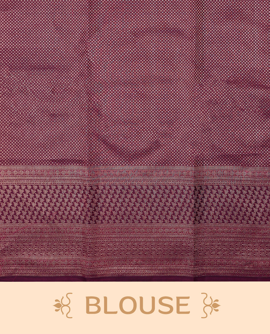 Mulberry purple Colour Manthrakodi saree featuring Antique Zari geometric brocade pattern on the body, complemented by a brocade border and a matching self coloured blouse.