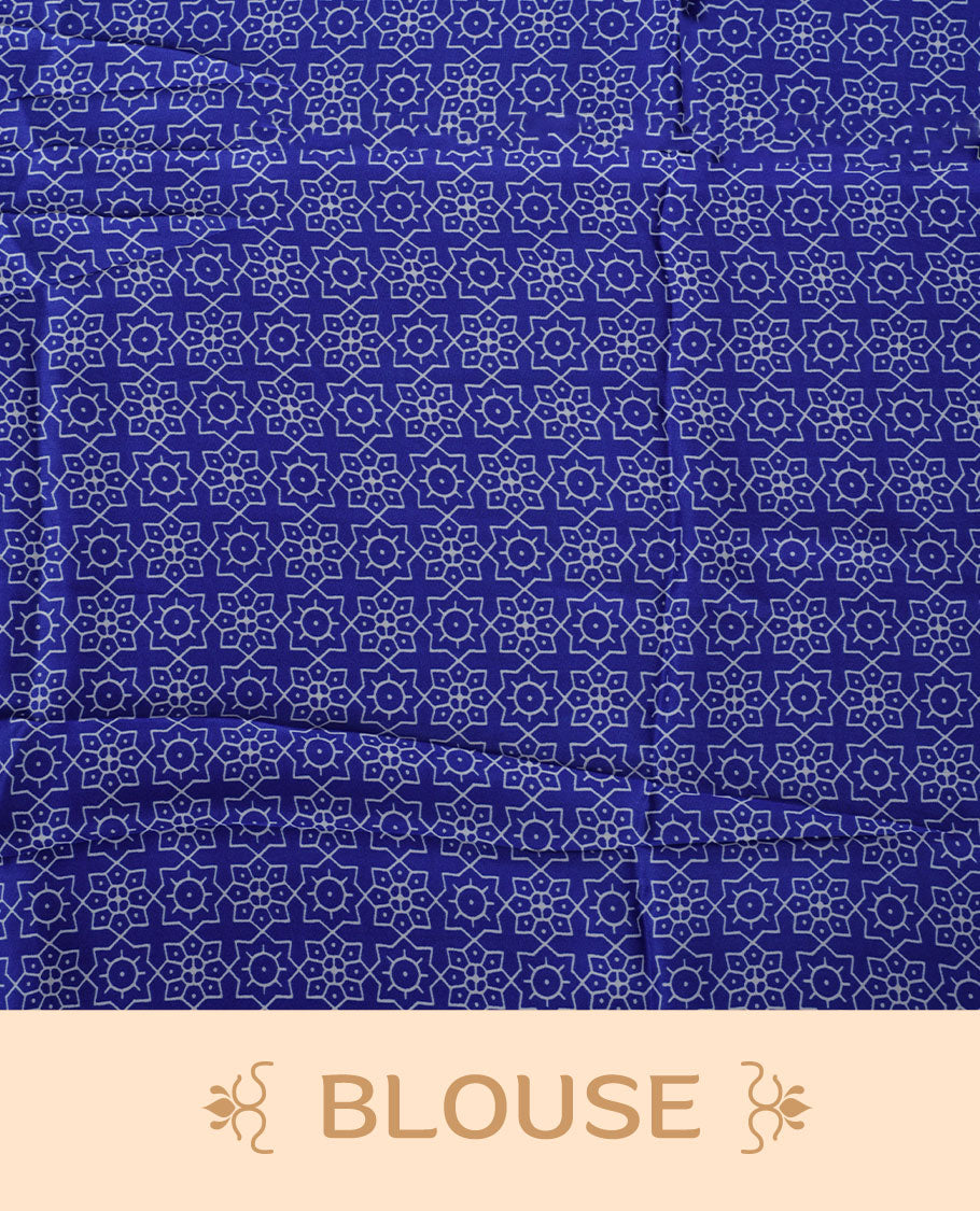 Royal blue colour semi modal saree featuring white colour geometric borders and fine stripe detailing, finished with an oversized circular motif on the pallu, paired with a matching printed blouse.