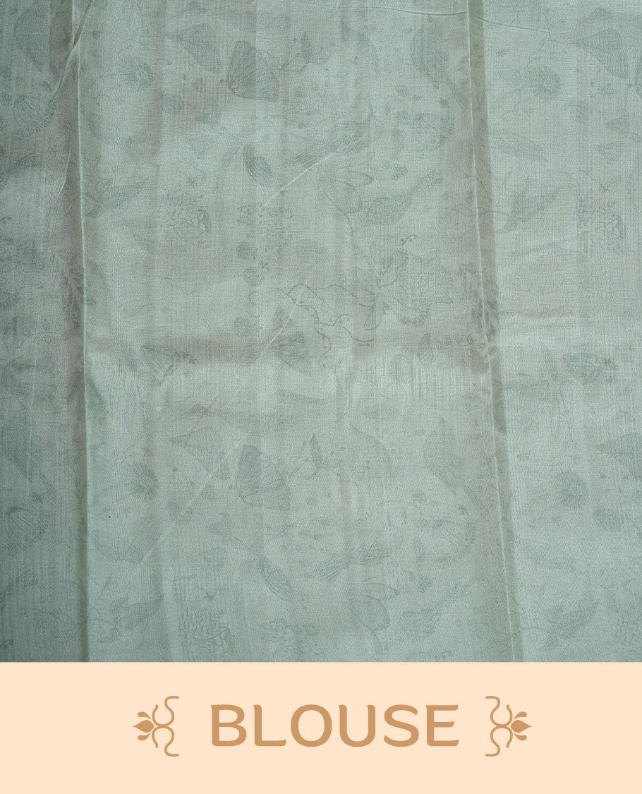 Powder blue colour semi tussar silk saree featuring all over floral and leaf motifs on the body with a subtle self border and tasselled pallu, paired with a matching blouse.