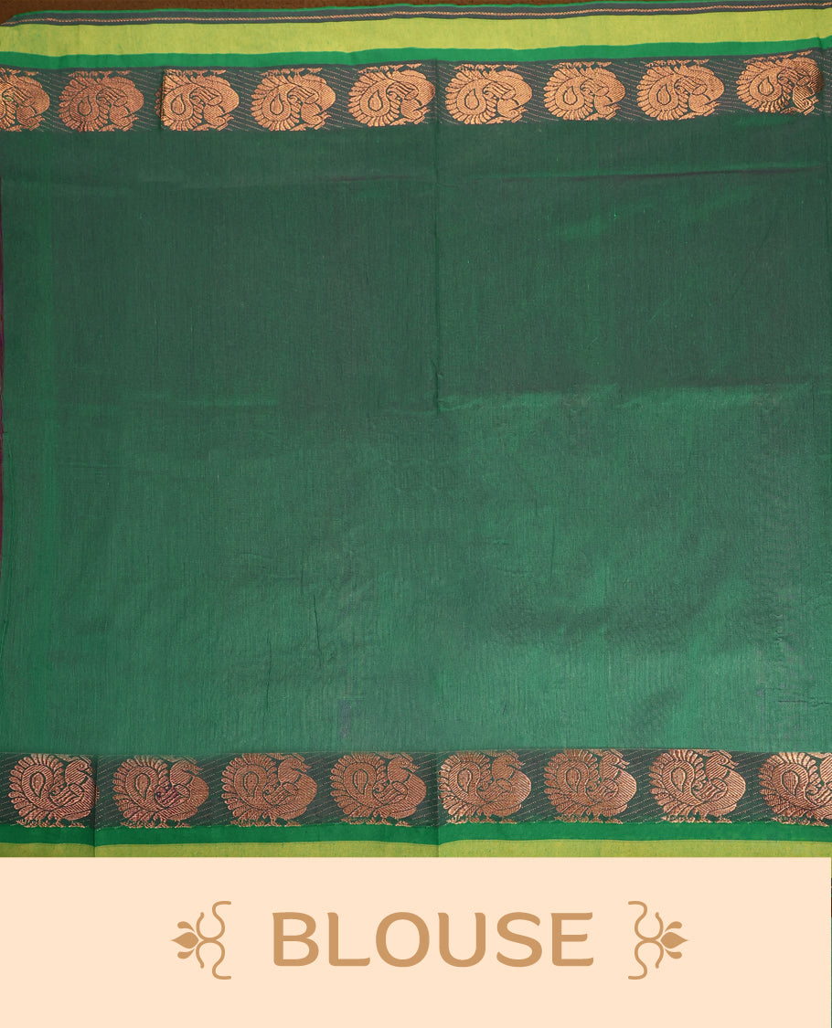 Maroon and Bottle Green Kalyani cotton saree adorned with traditional peacock motifs, enhanced by a rich woven zari border and pallu in green, paired with a matching blouse.