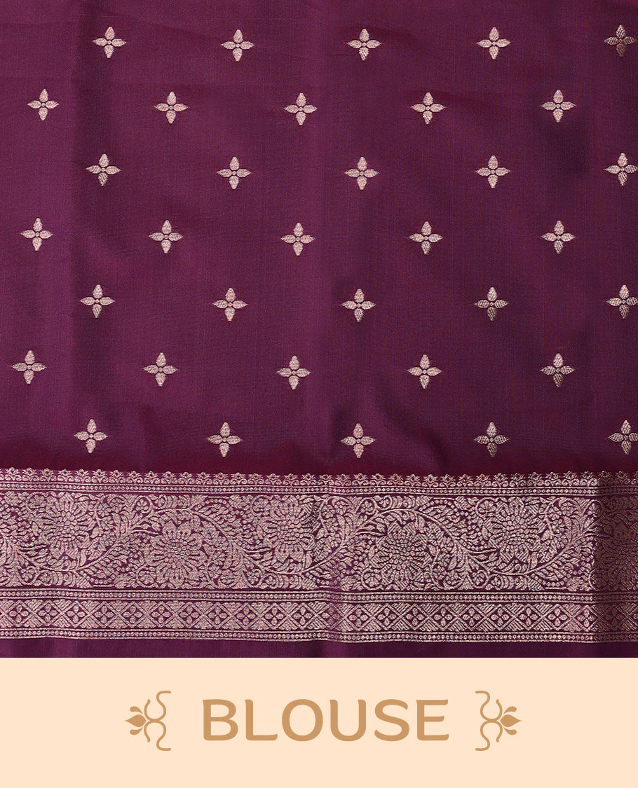 Grape Wine coloured semi silk saree featuring a Golden Zari Butta design on the body, paired with a Self coloured border and matching blouse.