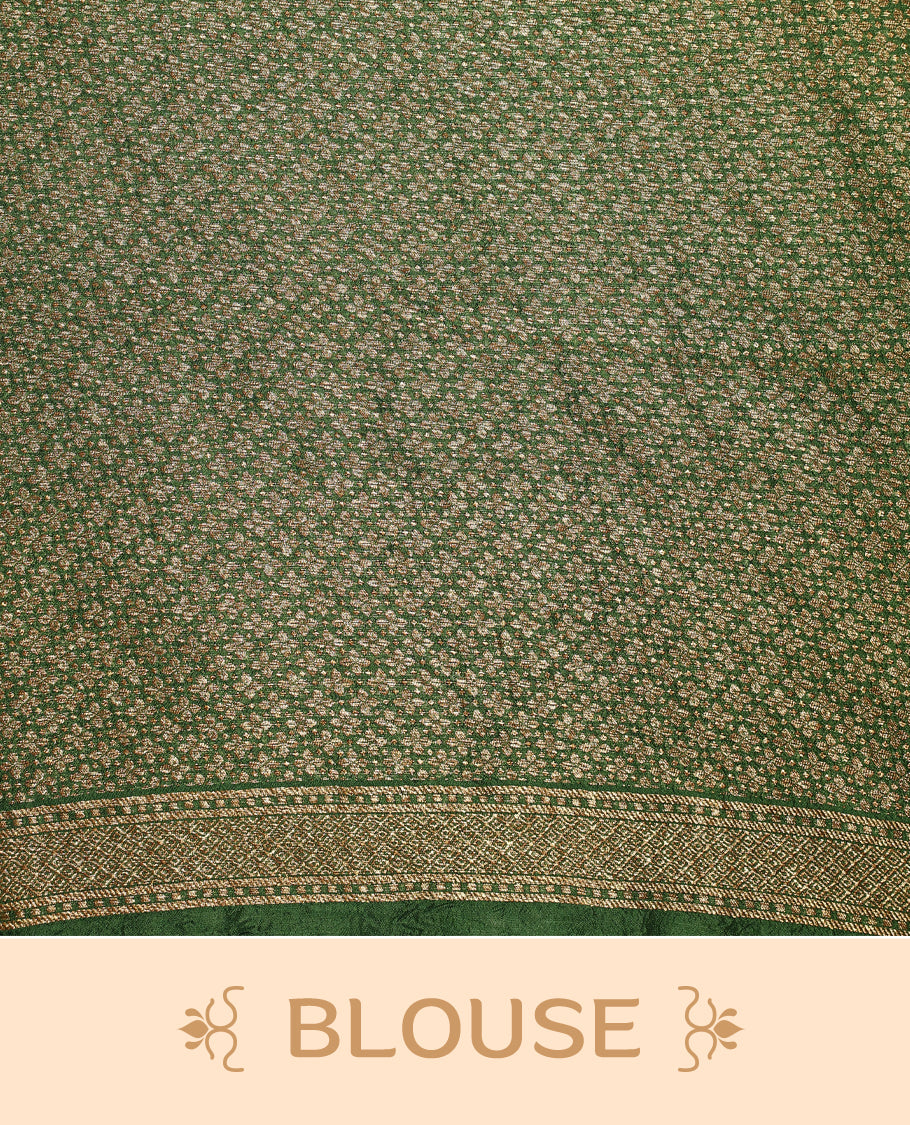 Bottle Green colour Tussar Banaras saree adorned with delicate golden zari motifs on the body, rich floral woven zari border and grand pallu, paired with a matching blouse for an elegant and regal traditional look.