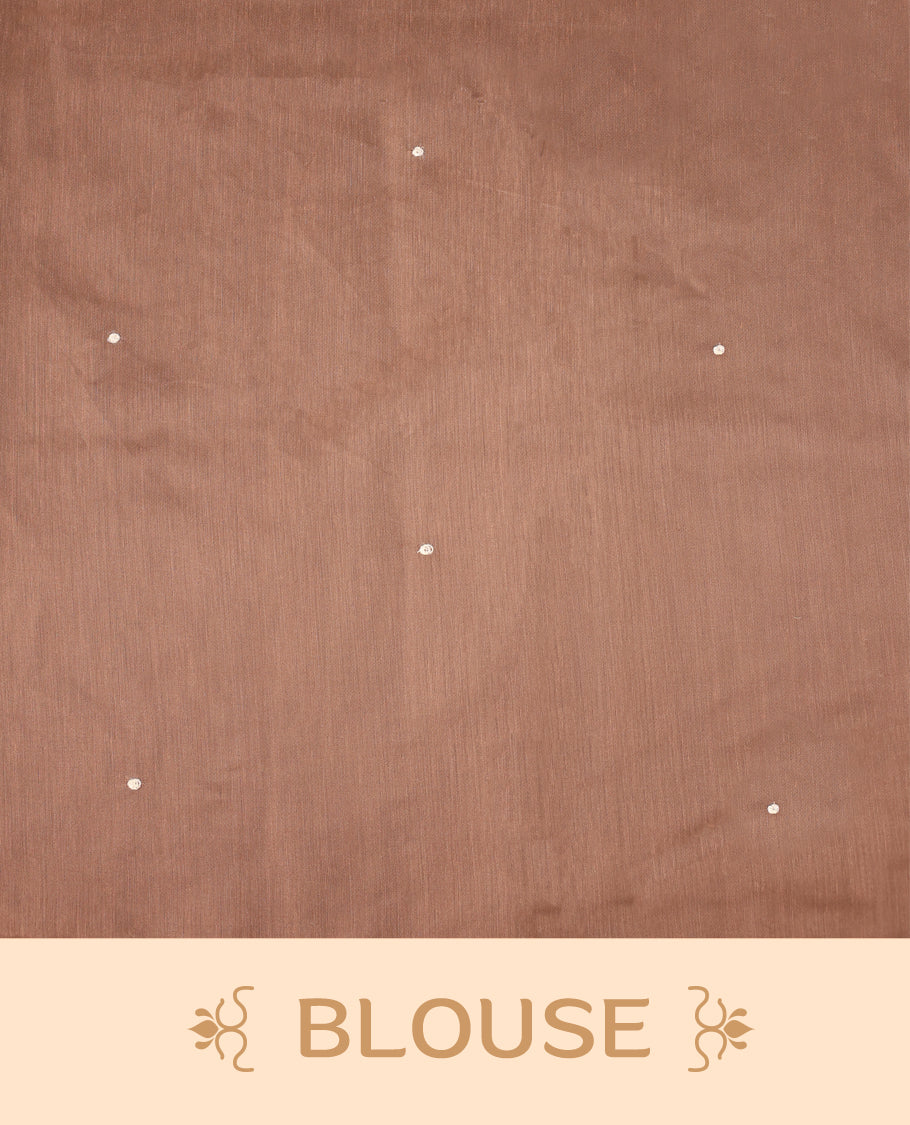 Cream colour Tussar cotton Kota saree featuring delicate Block printed leaves motifs across the body, highlighted with a subtle brown border, paired with a matching blouse.