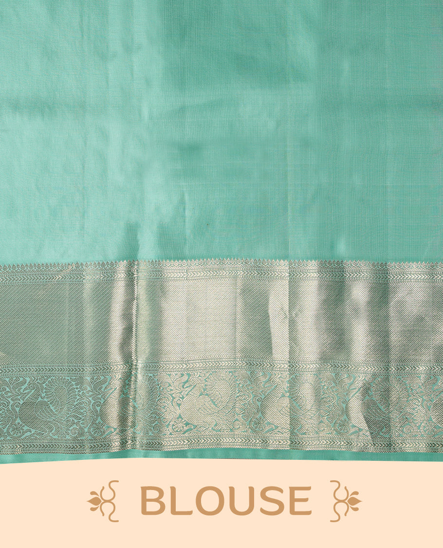 Light aqua Colour pure traditional Kancheepuram silk saree embellished with antique zari motifs on the body, gracefully complemented by a traditional peacock design border, and paired with a matching blouse.