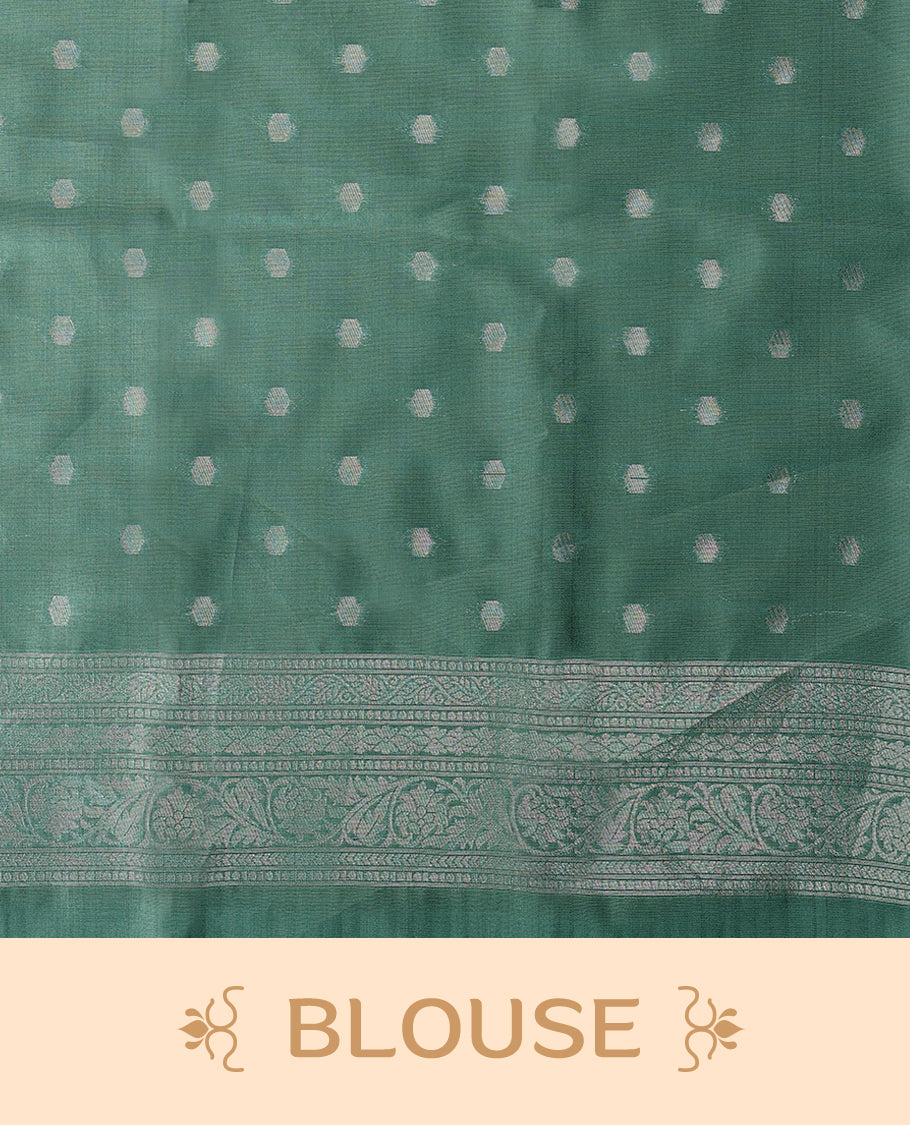 Pastel Aqua coloured semi silk saree featuring a Silver coloured Zari Diamond design on the body, paired with a Self coloured border and matching blouse.