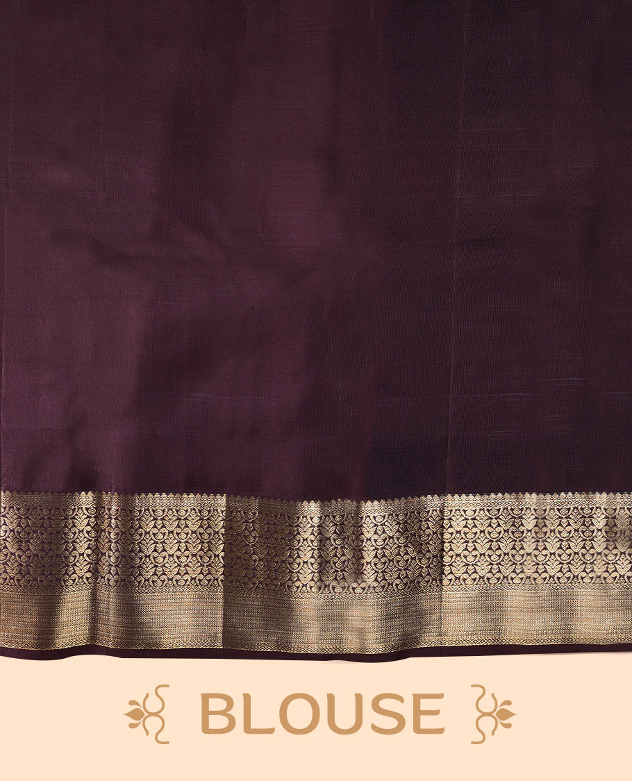 Soft blush Colour traditional Kancheepuram silk saree adorned with antique zari floral kodi motifs on the body, featuring a dark maroon border with rich, heavy golden zari floral Kodi patterns, and paired with a matching blouse.