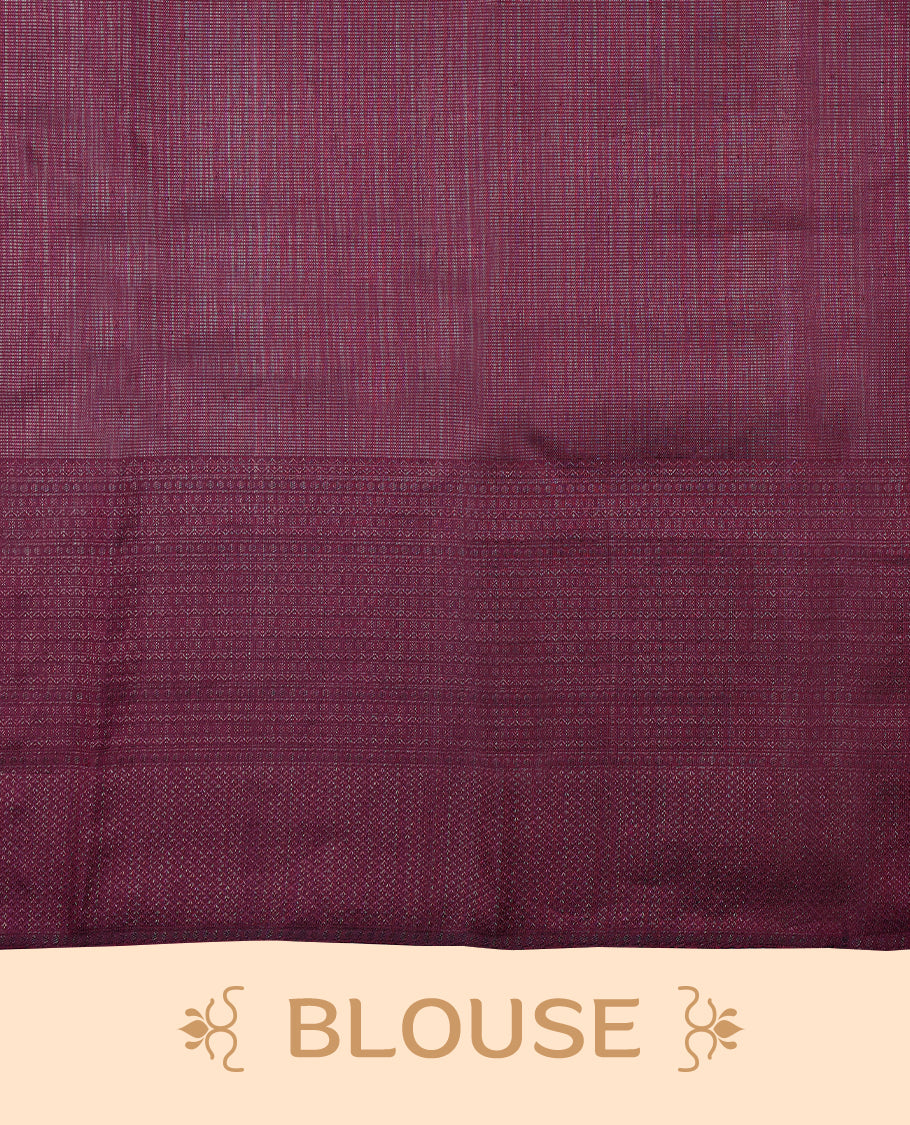 Cranberry coloured Manthrakodi saree featuring a multicoloured zari jacquard body, complemented by a self coloured turning Banarasi border and a matching self coloured blouse.