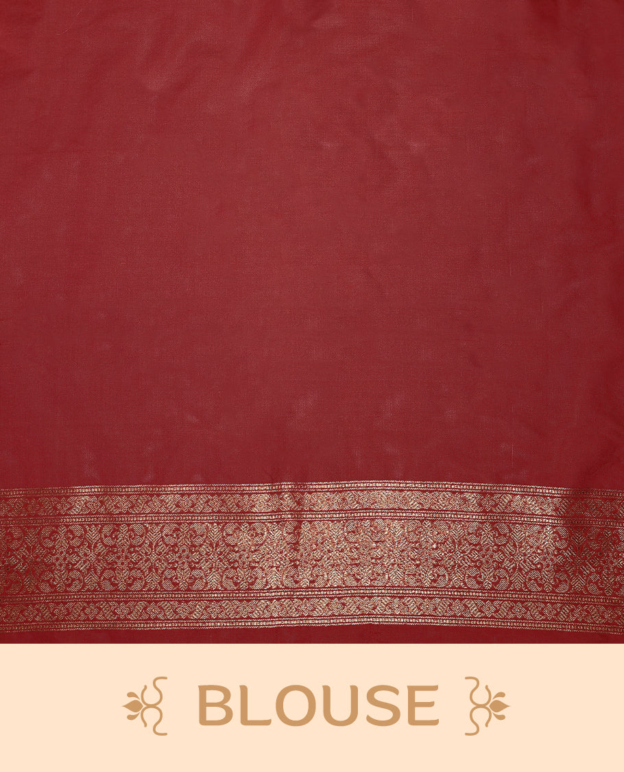 Maroon colour semi Banaras Katan saree featuring an antique Gold zari jacquard body, complemented by a self colour traditional border with a floral kodi design, paired with a matching blouse
