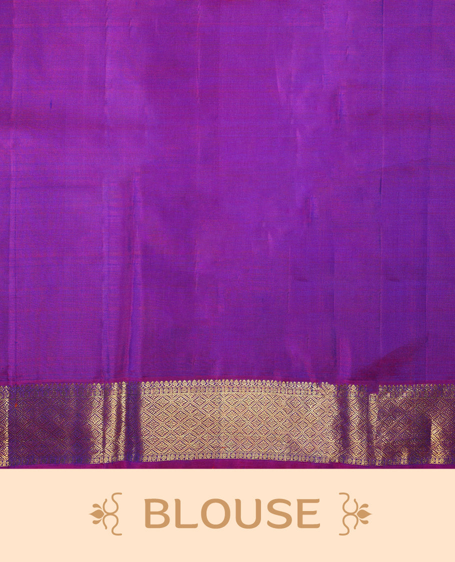 Peacock blue colour pure Kancheepuram saree with gold zari paisley mango motifs on the body traditional border with diamond pattern and purple piping grand pallu paired with matching blouse