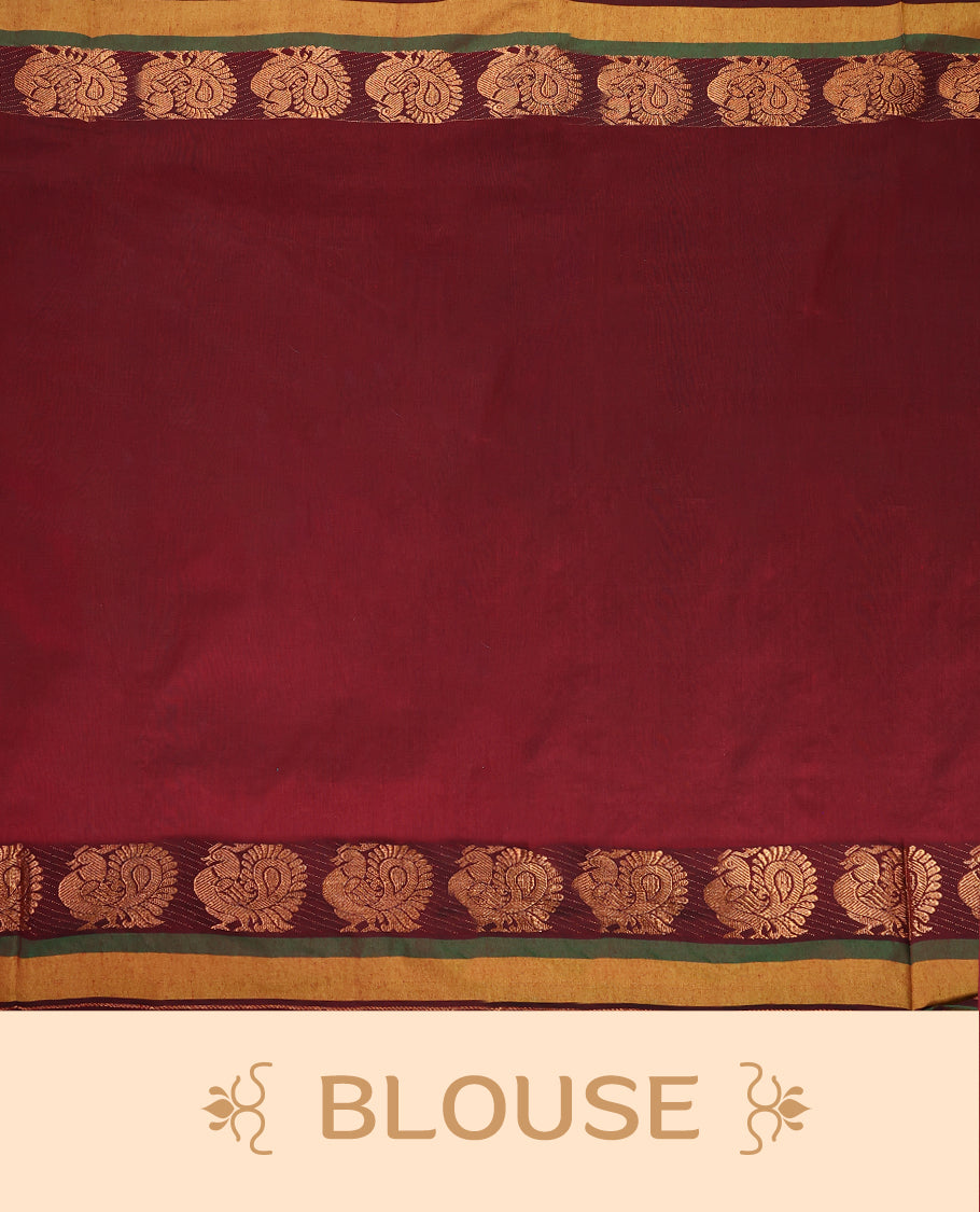 Olive Green and Maroon Kalyani cotton saree featuring subtle woven motifs on the body, accentuated with rich zari peacock designs on the border and pallu, paired with a matching blouse.
