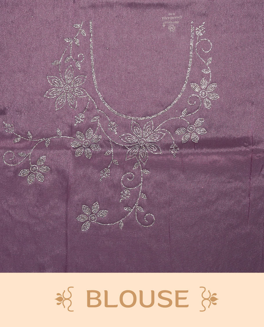 Lavender Colour net shimmer fancy saree adorned with scattered white stone buttas all over the body, paired with a delicate stone worked border and matching blouse.