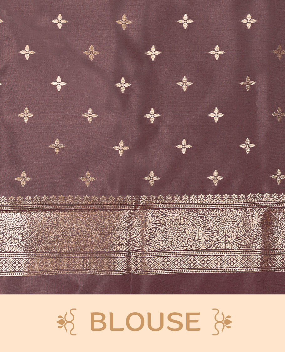 American Brown coloured semi silk saree featuring a Golden Zari Butta design on the body, paired with a Self coloured border and matching blouse.