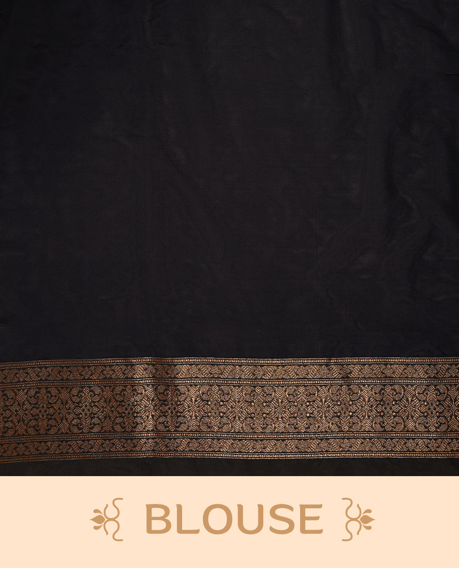 Black colour semi Banaras Katan saree featuring an antique Gold zari jacquard body, complemented by a self colour traditional border with a floral kodi design, paired with a matching blouse