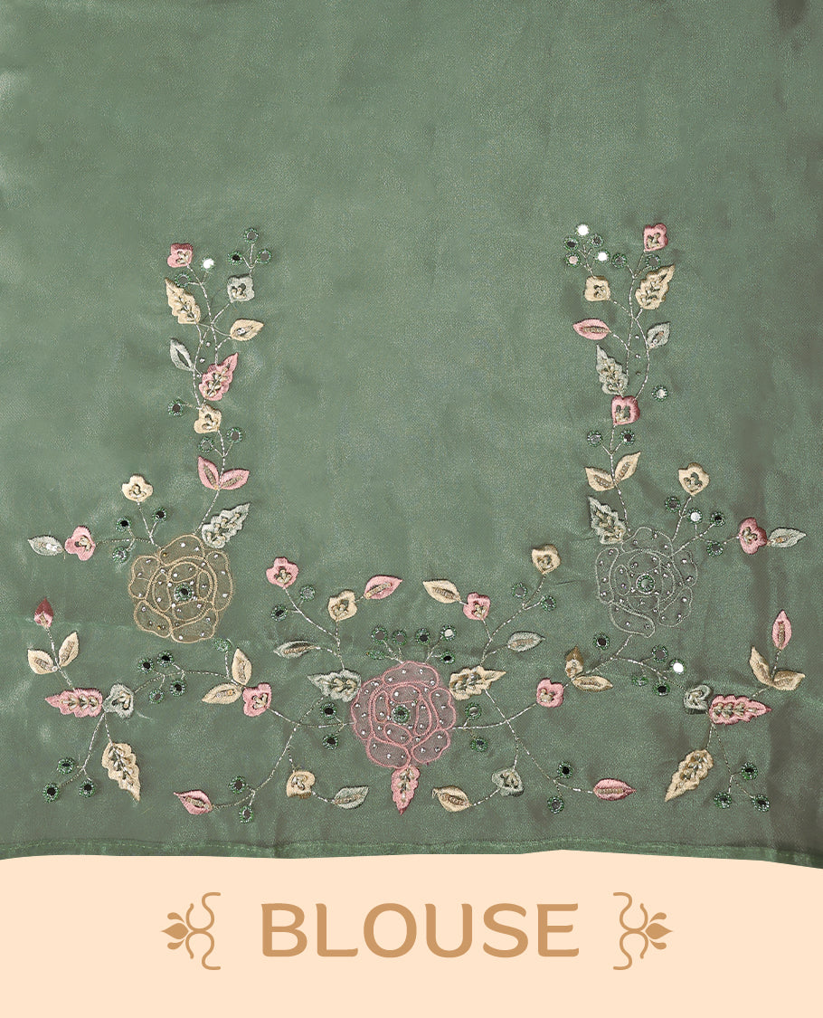 Pastel Green Colour organza saree featuring delicate floral embroidery with applique, bead, mirror, and thread detailing on the body and scalloped border, lending a soft feminine charm, paired with a matching blouse.