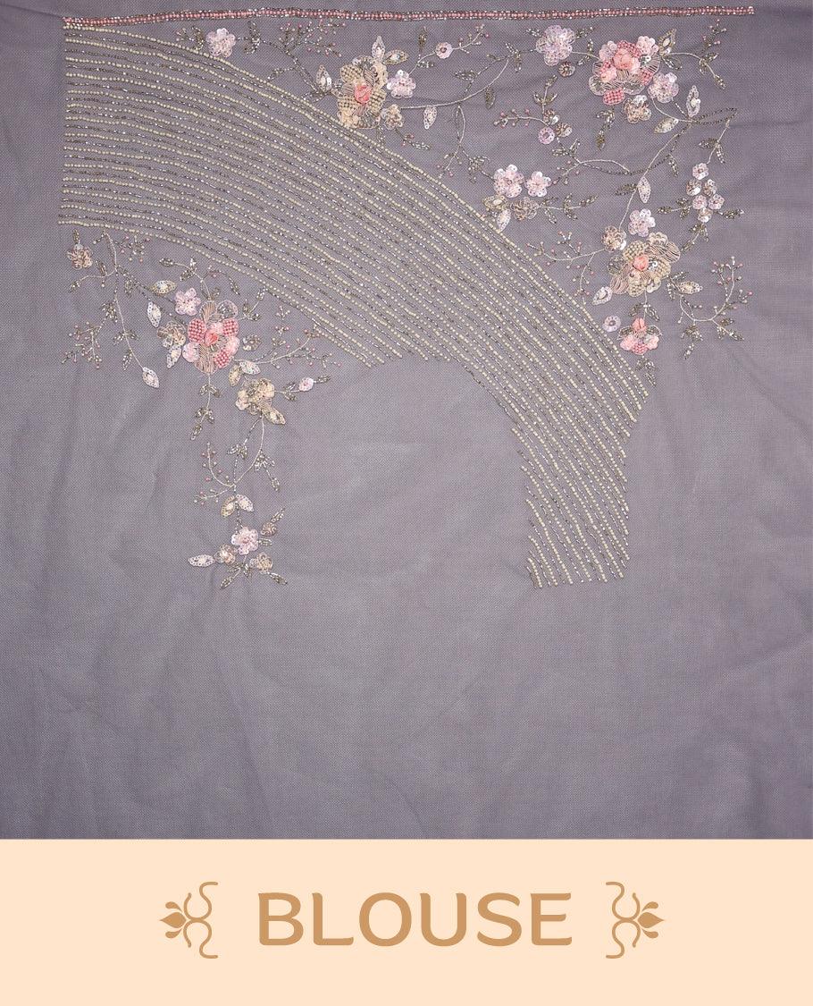 Pastel purple colour pure organza saree featuring all over sequin work, adorned with a matching floral kodi intricately worked border, complemented by a richly worked pallu and paired with a heavily embellished matching blouse.