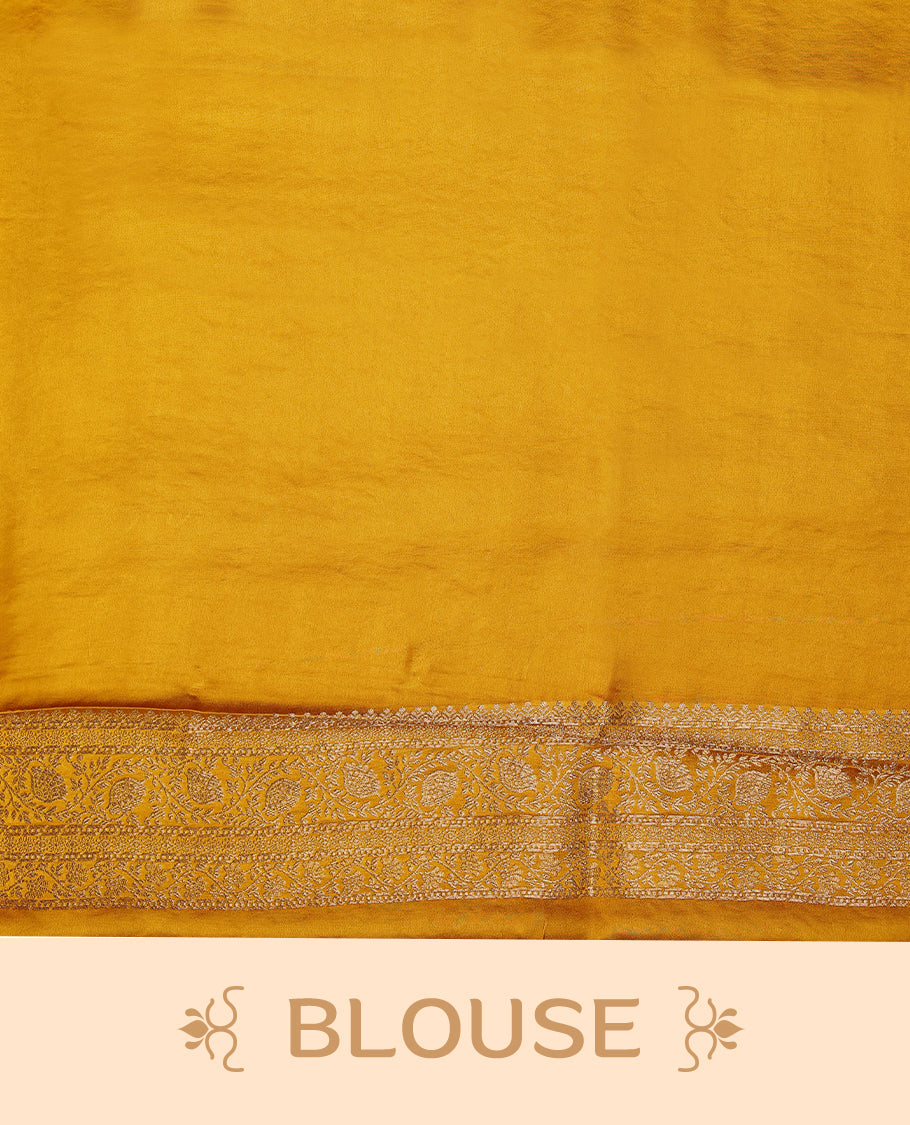 Mustard Gold semi-Banaras satin crepe saree featuring traditional closely woven buttas on the body, complemented by an antique-style border and a matching self-coloured blouse.